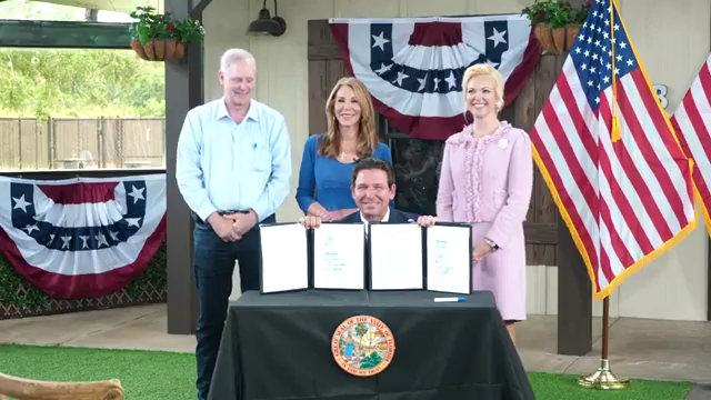 Florida animal cruelty bill signing with Gov. Ron DeSantis, Wilton Simpson and Melanie Griffin at Big Dog Ranch Rescue.