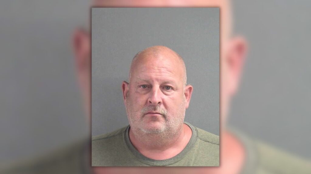 New Smyrna Beach dog daycare owner Donald Alan Hemphill mugshot after his arrest on video voyeurism charges.